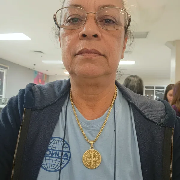 Claire R. wearing the Saint Benedict Necklace